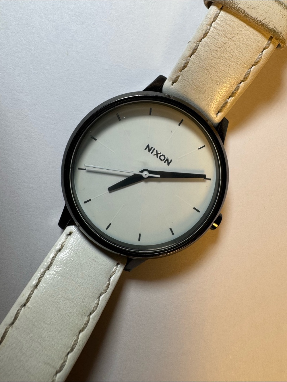 Nixon “Movin’ Out” Kensington analog watch with white leather band
